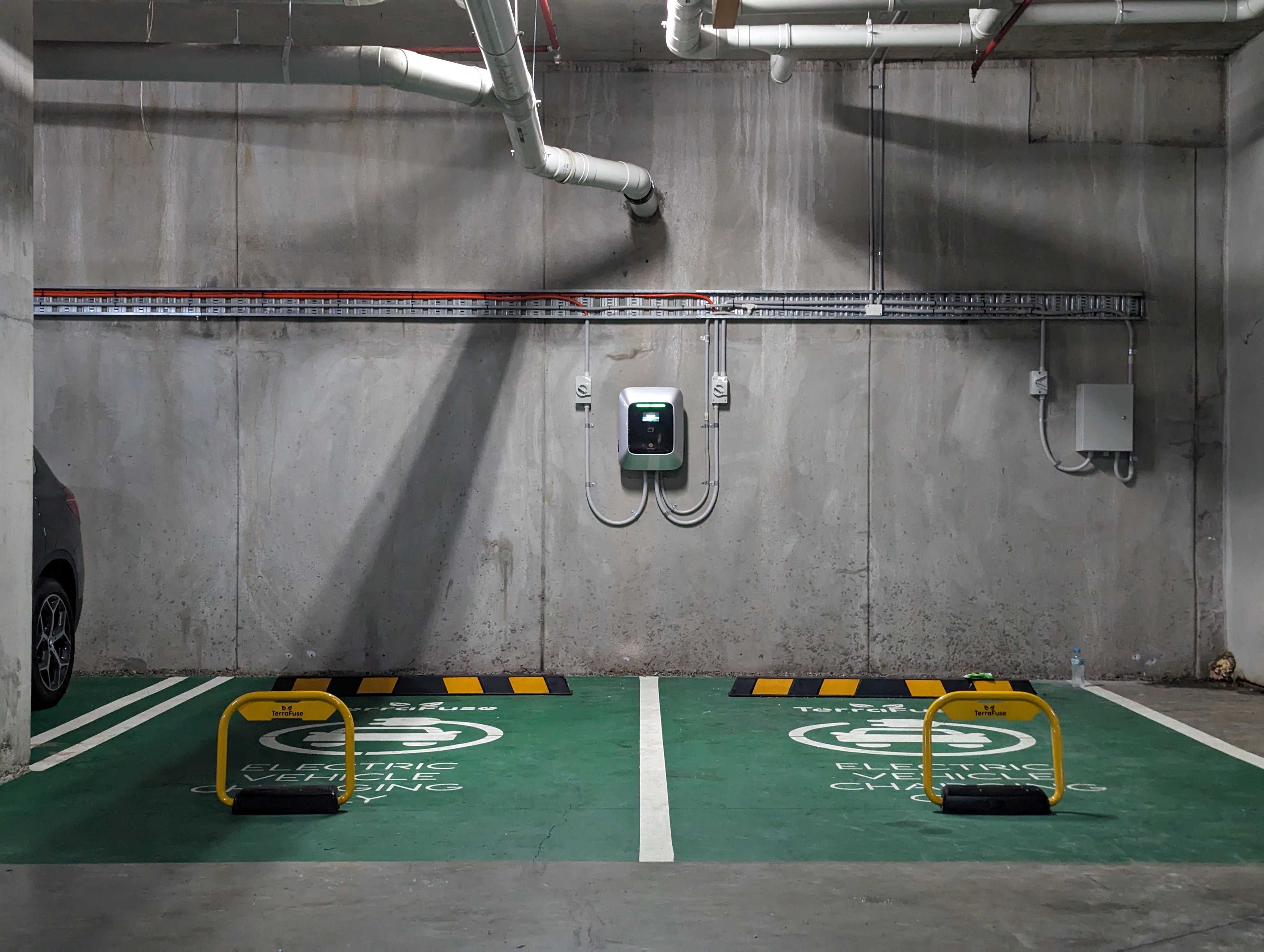 Communal EV charging bays in a strata basement